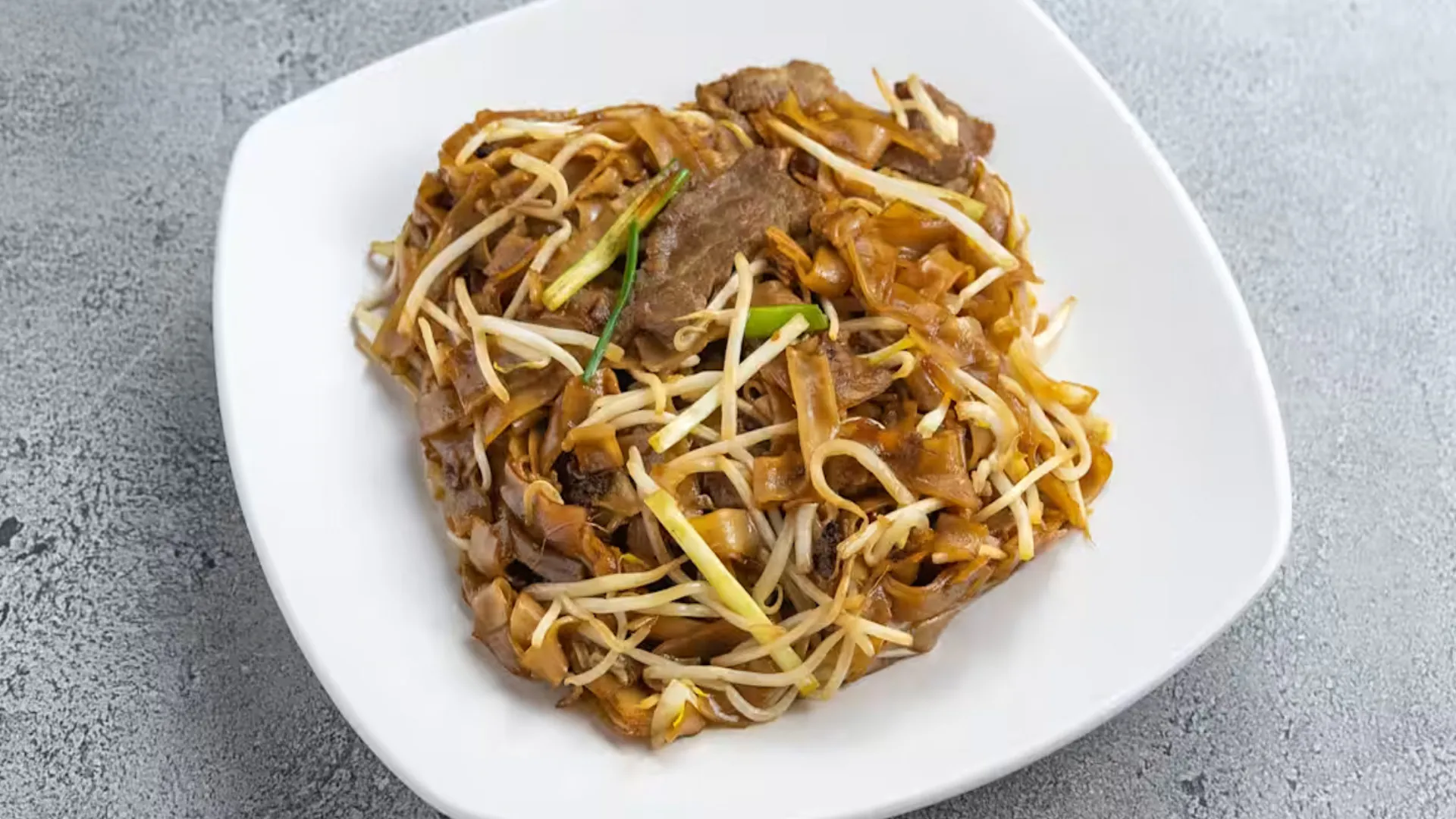 Stir-fried flat rice noodles with tender sliced beef and bean sprouts at Cheung Hing, a Chinese Restaurant in San Francisco