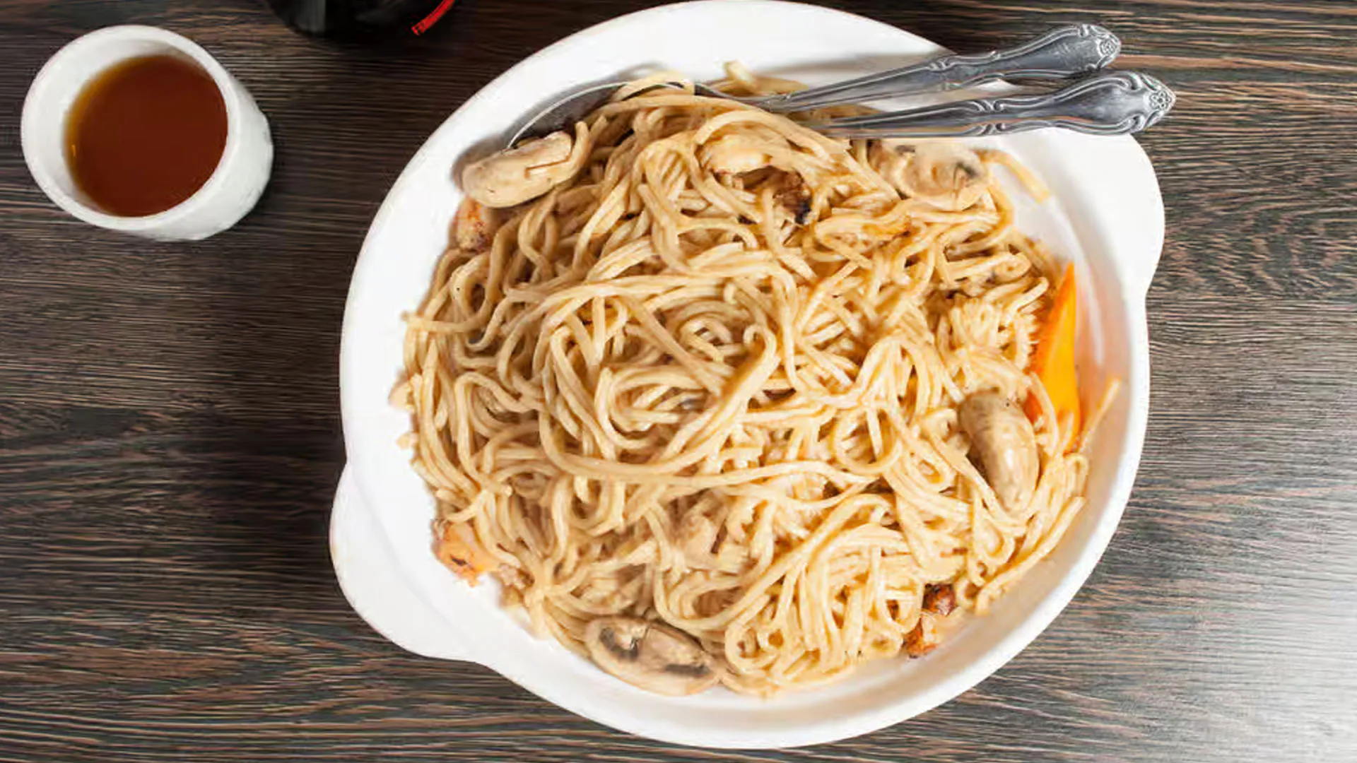 Braised soft tofu noodles with dry scallops and enoki mushrooms in savory broth at Cheung Hing, a Chinese Restaurant in San Francisco
