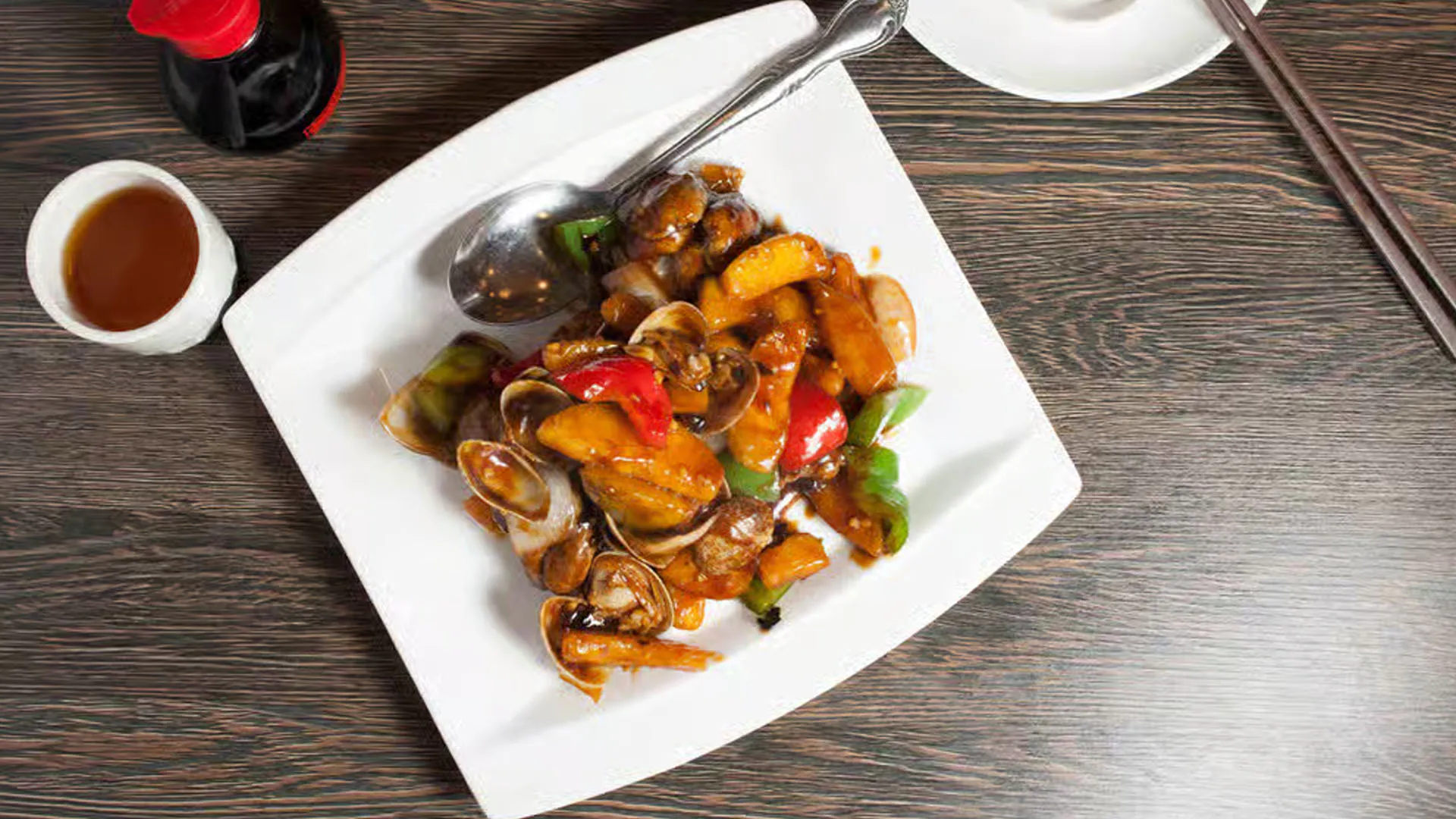 Stir-fried pumpkin and clams tossed in rich black bean sauce at Cheung Hing, a Chinese Restaurant in San Francisco