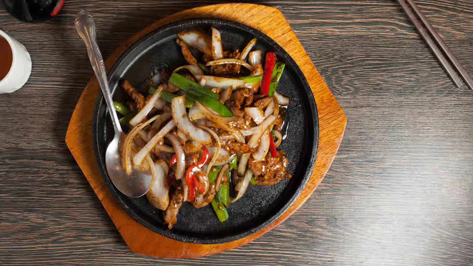 Sizzling black pepper beef fillet served on hot iron platter with veggies at Cheung Hing, a Chinese Restaurant in San Francisco