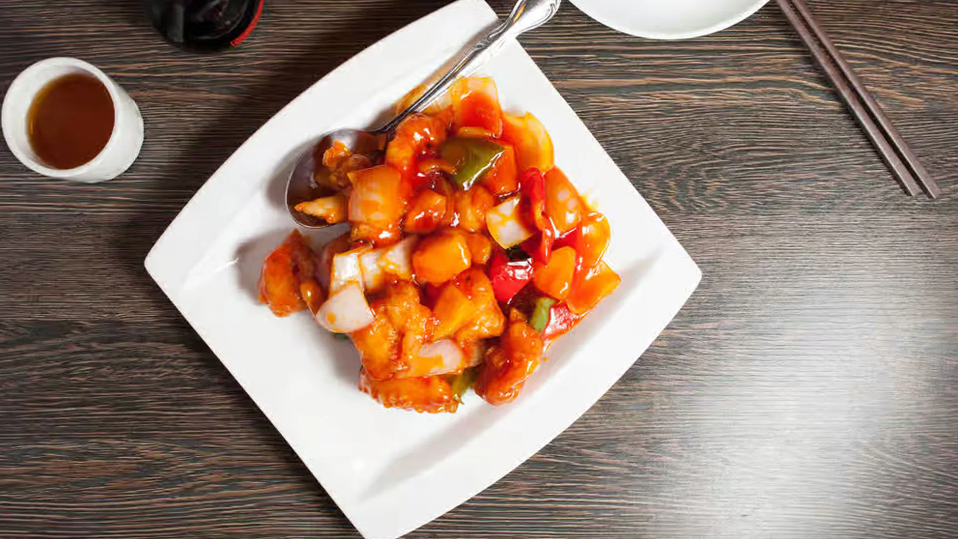 Crispy sweet and sour pork chunks with glossy orange fruit sauce at Cheung Hing, a Chinese Restaurant in San Francisco
