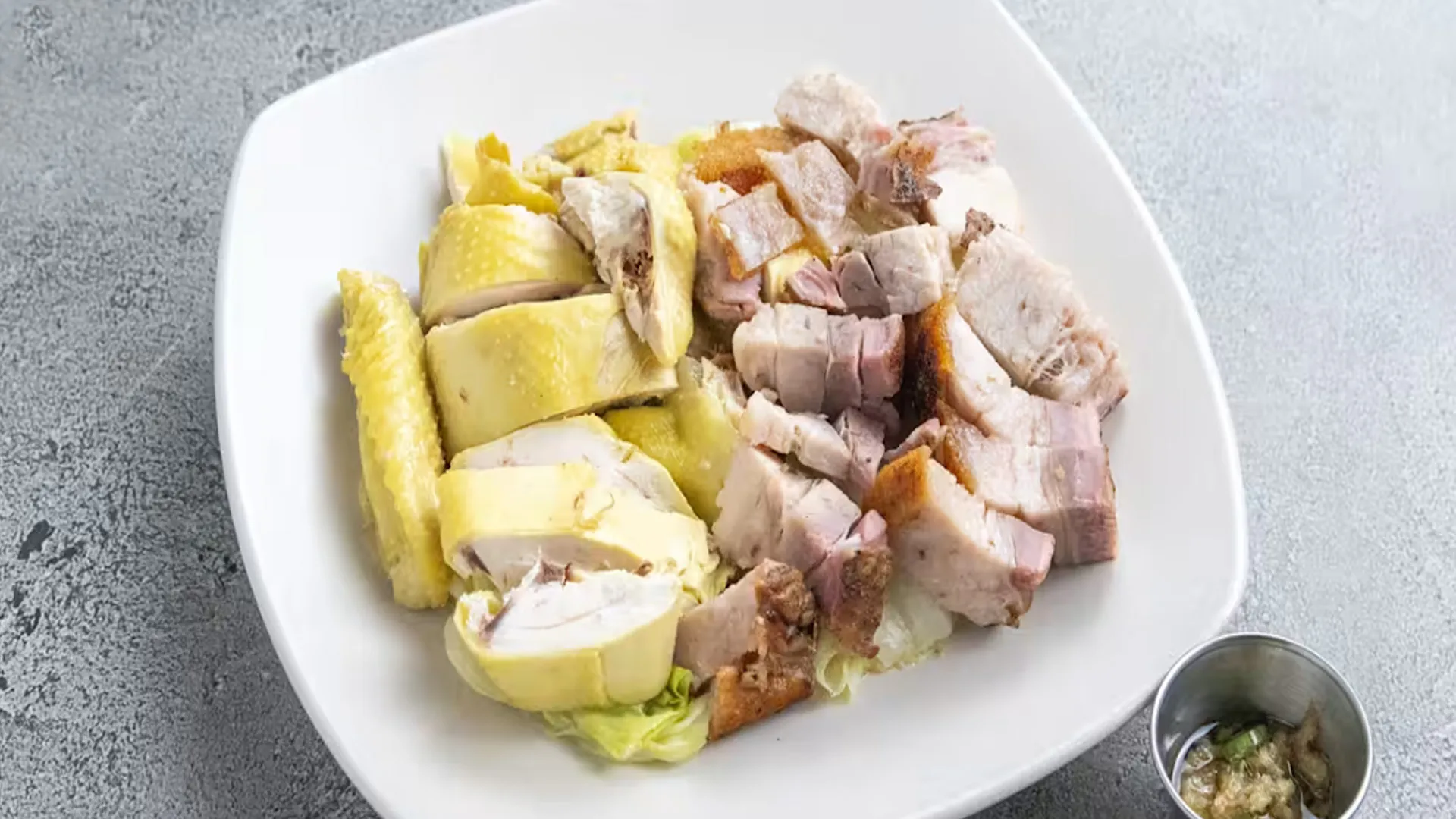 Two-item roasted barbecue combo plate with chicken and pork cuts at Cheung Hing, a Chinese Restaurant in San Francisco